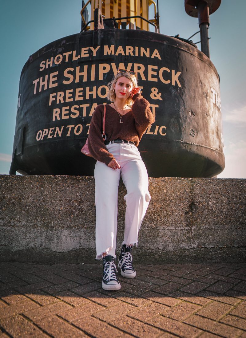 lucy styling white jeans in winter with brown jumper