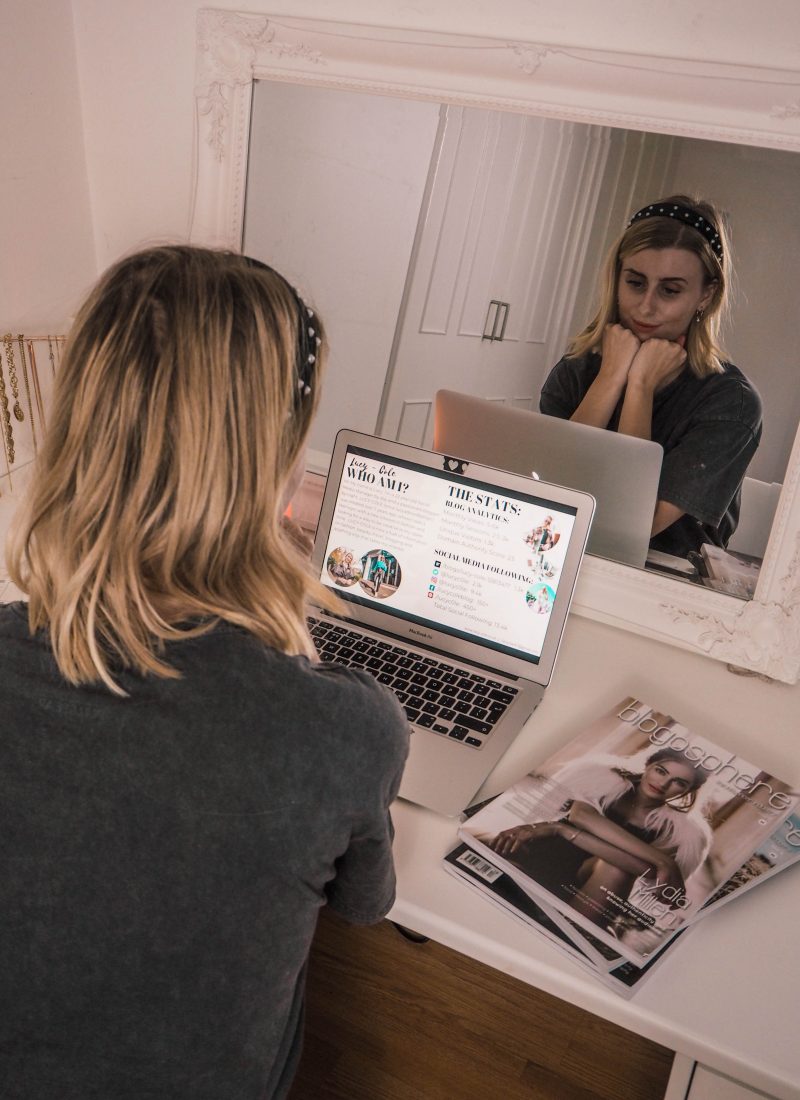girl looking at media kit on laptop